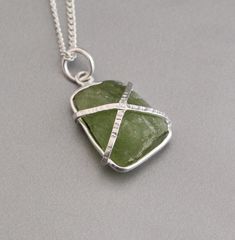 Description Healing with Peridot♥ Healing ♥ Renewal ♥ Purification ♥ Rebirth ♥ Growth ♥ Relaxation ♥ Comfort ♥ IntuitionThis stunning necklace comes with a silver framed, Raw gemstone and a 40cm chain.✦Gemstone: Natural Raw Peridot✦Stone Cut: Raw Stone✦Pendant Length: Approximately 4.5 Cm including loop✦Metal: 925 Sterling Silver Natural stones may vary slightly in shape, size and color.Handmade ItemYou will receive the same piece as in the picture or identical. Since all gemstones are different from each other, I cannot guarantee that the gemstone you see above will still be available.. But I assure you will get same quality piece as shown in the above picture.# Your order will be dispatch within 3-5 working days after receiving order# Items will be sent via registered airmail and take ap Green Peridot Necklace For Gift, Silver Peridot Jewelry As Gift, Silver Peridot Necklaces For Jewelry Making, Silver Pendant Necklace With Peridot, Handmade Silver Peridot Necklaces, Handmade Silver Necklace With Peridot, Handmade Silver Peridot Necklace, Green Wire Wrapped Necklace For Gift, Handmade Peridot Necklaces For Gifts