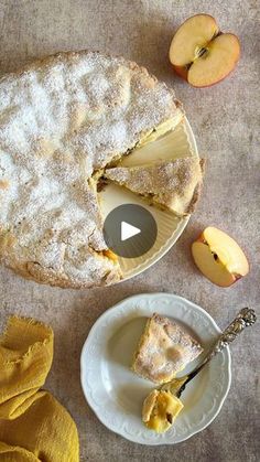 an apple pie with one slice cut out and another piece on the plate next to it