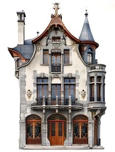 an old style house with many windows and balconies on the top floor is shown