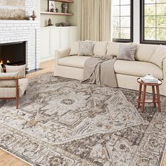 a living room filled with furniture and a fire place