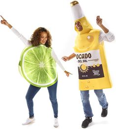 two people dressed in costumes that look like they are holding bananas and kiwis