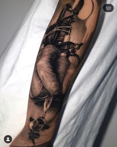 a man's arm with an elephant tattoo on it