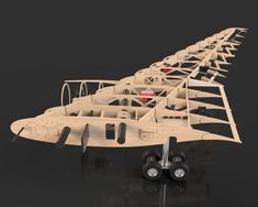 a wooden model of an airplane on a black background