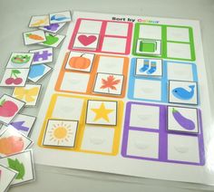 an assortment of cut and pasted cards on a table with the words sort by color