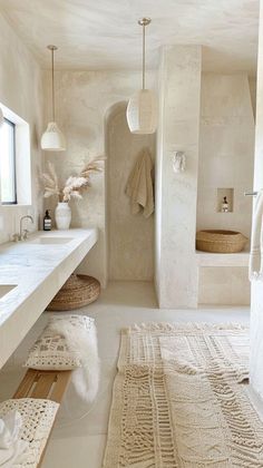 a large bathroom with white walls and flooring