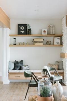 a living room filled with furniture and shelves