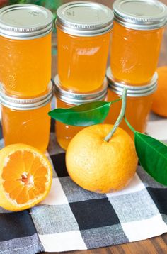 oranges and jars with the words satsuma jelly recipe