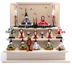 a group of figurines sitting on top of a set of steps