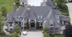 an aerial view of a large gray house