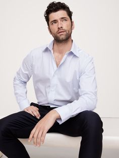 Designed for ease of wear and care, this sleek dress shirt employs a special cotton fabric with PUREPRESS™ cotton technology, a special process that smooths and protects the fabric, resulting in a wrinkle-resistant finish.  Standard Fit: A straight and easy fit.  Spread collar.  Shirttail hem.  Standard Fit: A straight and easy fit.  Long sleeves.  Hip length.  Model: Size M, 6'2" Sean O'pry, Sleek Dress, Take It Easy, Hip Length, Blue Stripes, Dress Shirt, Banana Republic, The Body, Personal Style