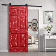 an open red door in a white room