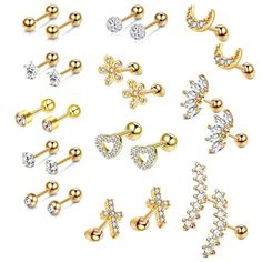 various types of piercings with different shapes and sizes on them, all in gold