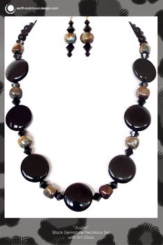 This stunning high fashion necklace would make a fabulous gift for a stylish collector. Snap up this chic black gemstone set today. Elegant Onyx Crystal Necklaces With Black Beads, Black Crystal Necklaces With Round Natural Stones, Black Onyx Jewelry With Black Beads, Luxury Black Beads Jewelry For Formal Occasions, Elegant Jewelry With Round Pendant And Natural Stones, Elegant Adjustable Black Crystal Necklace, Elegant Black Beaded Necklaces With Stones, Luxury Black Jewelry With Gemstone Accents, Luxury Formal Jewelry With Black Beads