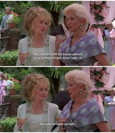 two women standing next to each other in front of a tree and text that reads, steel magnolias