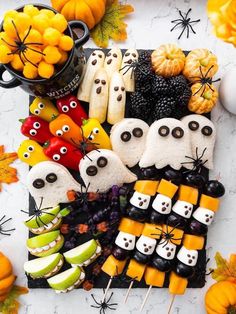 a table topped with halloween food and decorations