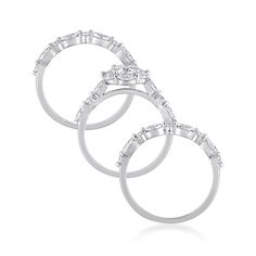 three white gold rings with diamonds on them