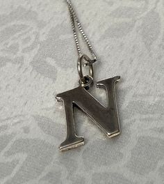 "Very cute! - Sterling Silver 925, Letter \" N\" Charm/ Pendant Necklace  Size-  18\" L  Pendant- 1/2\" x 1/2\" Weight: 3.2  grams  Stamped: 925  Condition :  good condition  Thank you for Visiting!" N Necklace, Initial N, Letter N, Cherry Bomb, Charm Pendant Necklace, Necklace Size, Pretty Earrings, Necklace Sizes, Star Earrings