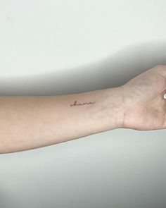 a person's arm with a tattoo that says love on the left side of their arm