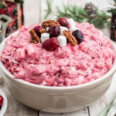 a bowl filled with fruit and marshmallows