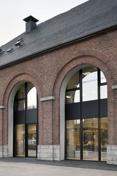 an old brick building with arched doorways