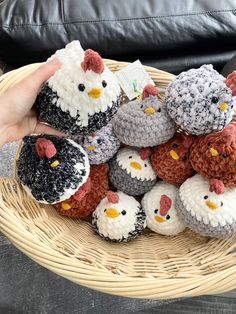 a basket filled with small crocheted chickens and chicks on top of each other