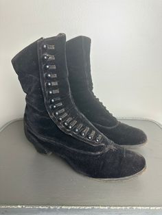 These Victorian Era velvet boots are in excellent vintage condition. All buttons are intact. There are two small repairs at the base of the buttons.  These shoes fit between a 6-7 women's shoe. They are quite narrow and tapered at the end. Please see photos for condition and measurements. Victorian Womens Boots, Victorian Black Boots With Round Toe, Black Victorian Boots With Round Toe, Victorian Black Boots For Formal Occasions, Black Victorian Boots For Formal Occasions, Victorian Boots, Historical Dress, Bullet Bra, Velvet Boots