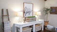 a white table topped with baskets and lamps