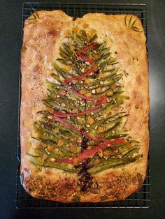 a christmas tree made out of bread on a cooling rack