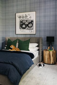 a bedroom with a tiger pillow on the bed