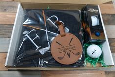 the golf gift box is packed and ready to be delivered