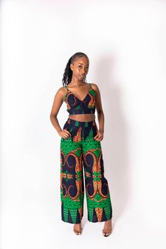 This Kimmy African print co-ord is the perfect fit for the summer. Made from 100%cotton fabric and stitched to excellent quality.  Why not pair it up with some tan summer sandals for the perfect day look. Alternatively white sandal heels for a chic evening look. Features: - 100% cotton fabric  - wax cotton print  - elasticated waist  - matching top included  Model 1 wears size 8 UK Model 2 wears size 18 UK Care Instructions: Handwash or dryclean only  Do not bleach Hang to dry Multicolor Two-piece Pant Set For Summer, Green Two-piece Set For Vacation, Green Two-piece Vacation Set, Casual Printed Cotton Sets, Cotton Printed Pants For Vacation, Summer Cotton Sets With Long Pants, Cotton Long Pants Set For Summer, Fitted Cotton Pants For Vacation, Casual Patterned Cotton Sets