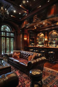 a living room filled with furniture and a bar