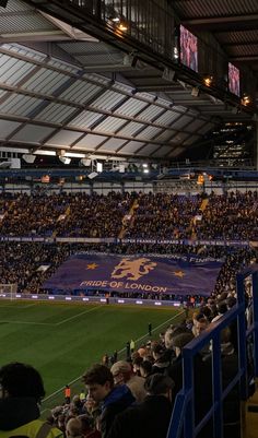 an indoor soccer stadium full of people