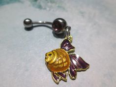 belly button ring yellow and purple fish purple stone stainless steel belly button jewelry 14 gage surgical steel https://www.etsy.com/shop/sindys Purple Fish, Belly Button Piercing Jewelry, Belly Piercing Jewelry, Belly Button Jewelry, Belly Jewelry, Body Jewelry Piercing, Yellow And Purple, Belly Piercing, Nose Jewelry