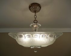 a chandelier hanging from the ceiling in a room