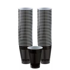 black and white cups stacked on top of each other in front of a white background