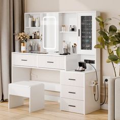 a white dressing table with drawers and stools next to a potted plant on the floor