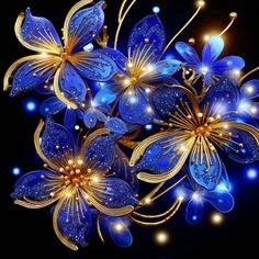 blue and gold flowers on a black background with lights in the dark behind them,