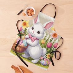 an easter bunny drawstring bag next to eggs and utensils on a table