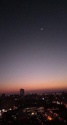 an airplane flying over a city at night