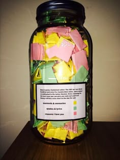 a jar filled with candy sitting on top of a table