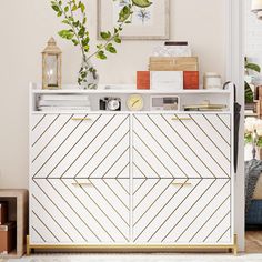 a white and gold sideboard in a living room