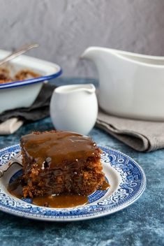 a piece of cake sitting on top of a blue and white plate