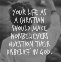 a woman holding her hands up with the words your life as a christian should make nonbelevers question their disbelief in god