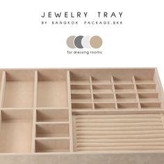 the jewelry tray is made out of wood and has multiple compartments for storing small items