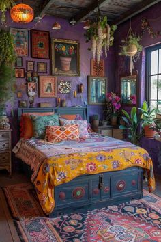 a bedroom with purple walls and lots of pictures on the wall above the bedspread