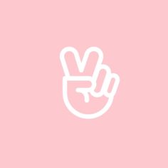 a pink wall with a white peace sign on it's left hand and two fingers in the middle