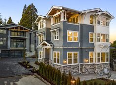 a two story house with lots of windows