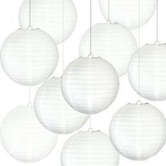 six white paper lanterns hanging from strings