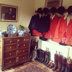 a room filled with lots of coats and boots